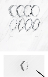Detailed view of S925 silver rings with crown, heart, and olive leaf patterns