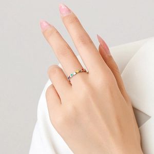 S925 sterling silver ring with colorful heart enamel worn on hand by female model