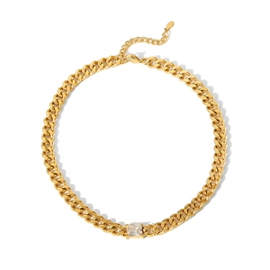 Detail of 18K gold plated curb chain necklace featuring a square cubic zirconia pendant