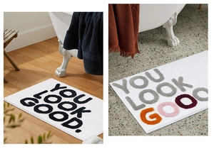 Close-up of soft flocked bathroom mat with colorful YOU LOOK GOOD jacquard letters
