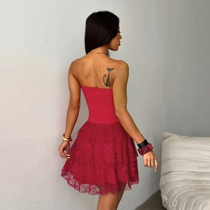Detail view of the back of a deep red lace strapless dress with a flattering A-line cut