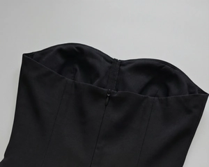 Detailed view of the black strapless bodice with heart neckline and invisible zipper