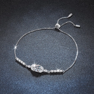 Adjustable 925 sterling silver moissanite bracelet with marquise stones on black background