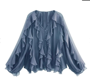 Detail of navy blue chiffon blouse showing multi-layered ruffles and front button closure