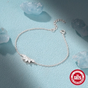 925 Sterling Silver bracelet with marquise-cut zircon leaf charm on a blue background