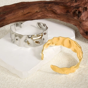 Minimalist 18k gold and silver adjustable C-shape bracelets with wavy hammered texture