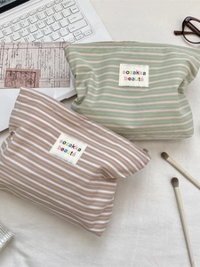 Striped cotton canvas cosmetic bag set with zipper and embroidered beauty label