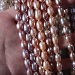 Handheld high-luster natural freshwater pearls in pink and purple for DIY jewelry
