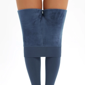 Detail of high-waist thermal leggings showing thick blue fleece lining and elastic fabric