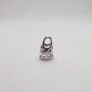 Detailed macro view of silver hollowed-out metal spacer beads for DIY jewelry making