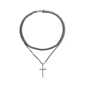 Double-layered silver Cuban chain necklace with a classic cross pendant for men