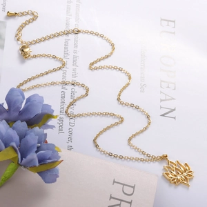 Minimalist hollow lotus pendant necklace in gold finish displayed on elegant background
