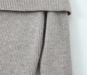 Macro detail of high-quality rib-knit texture on off-shoulder long sleeve mini dress