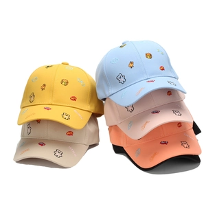 Colorful children's baseball caps with cute cartoon animal embroidery designs.