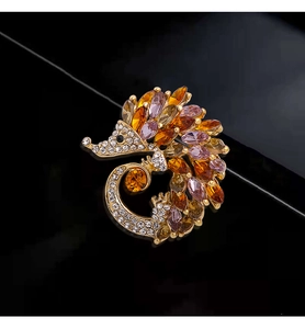 Close-up of hedgehog brooch with colorful marquise stones and sparkling rhinestones
