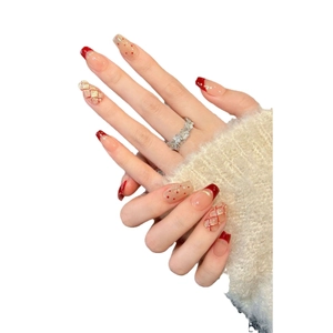 Red French tip press-on nails with cat eye plaid patterns and silver flower ring detail
