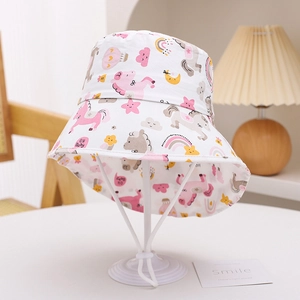 Close-up of children's sun hat with pink unicorn prints and adjustable chin strap