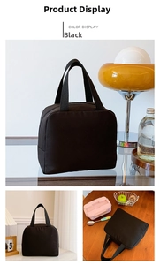 Detail view of the black insulated lunch tote bag with durable handles and thermal lining