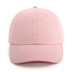 Close-up of pink cotton baseball cap featuring six-panel construction and breathable eyelets
