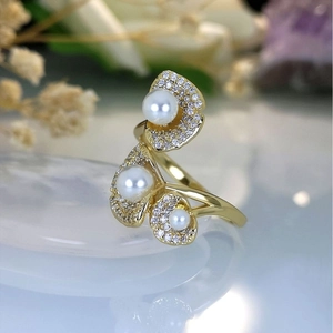 Elegant gold lotus leaf ring with pearls and pavé zircons on white quartz stones
