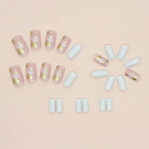 Square medium press-on nails in pink and white with gold foil leaf accents