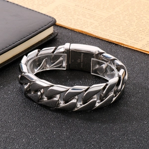 Close-up of 316L stainless steel Cuban chain bracelet with visible material engraving