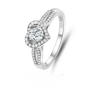 Macro view of S925 sterling silver heart ring with halo setting and split shank pave diamonds