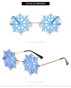 Detail of snowflake-shaped sunglasses with blue mirrored lenses and gold metal frame