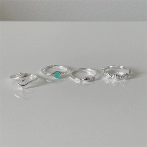Detail shot of S925 sterling silver rings with dolphin and seashell ocean designs