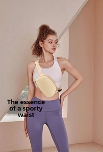 Detail view of cream nylon waterproof belt bag showing adjustable strap and matte finish