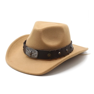 Detail of western cowboy hat featuring vintage bull head metal buckle and leather band