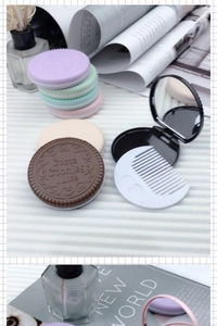 Detail of creative chocolate cookie compact mirror and comb set in various pastel colors