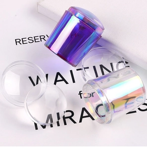 Detail showing iridescent nail art stamper handles and transparent silicone heads