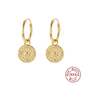 Detailed close-up of S925 sterling silver sunburst medallion earrings with small crystals