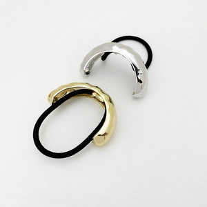 Minimalist hammered metal hair ties in gold and silver finish with black elastic bands