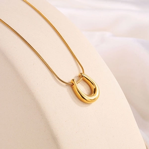 Elegant 18k gold plated stainless steel U-shaped pendant on a fine snake chain necklace