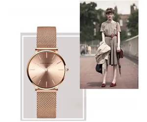 Detail of rose gold mesh strap quartz watch and lifestyle modeling on a female wrist