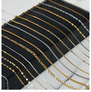Detailed macro shot of diverse gold and silver stainless steel necklace chain styles
