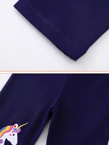 Dark blue girls' cotton leggings featuring colorful unicorn embroidery and reinforced stitching
