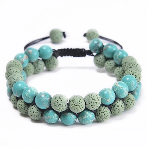 Macro view of adjustable double-layer turquoise and green lava stone braided bracelet