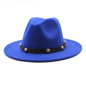 Detail of royal blue wool fedora with black band and gold metallic studs decoration