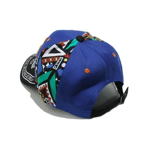 Detail of multi-color graffiti baseball cap with blue back panel and adjustable strap