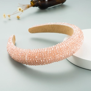 Detailed view of pink crystal beaded wide headband with velvet lining and thick sponge padding