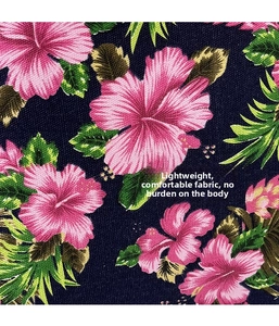 Macro shot of tropical hibiscus print on high-quality dark blue canvas fabric