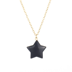 Detail of a polished black agate star pendant on a fine golden necklace chain