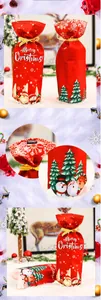 Detail of red Christmas wine bottle cover with Santa print and gold ribbon drawstring