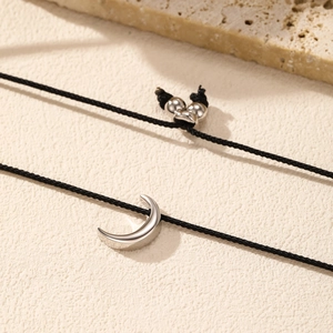 Minimalist S925 sterling silver crescent moon pendant on adjustable black woven cord bracelet