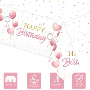 Pink birthday tablecloth detail with balloon patterns and waterproof function icons