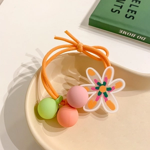 Detail of a floral hair tie with translucent flower pendant and colorful matte beads
