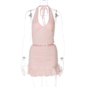 Detail view of pink halter neck top and ruffled mini skirt set on a mannequin
